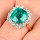 An 18ct gold Colombian emerald and brilliant-cut diamond cluster ring.