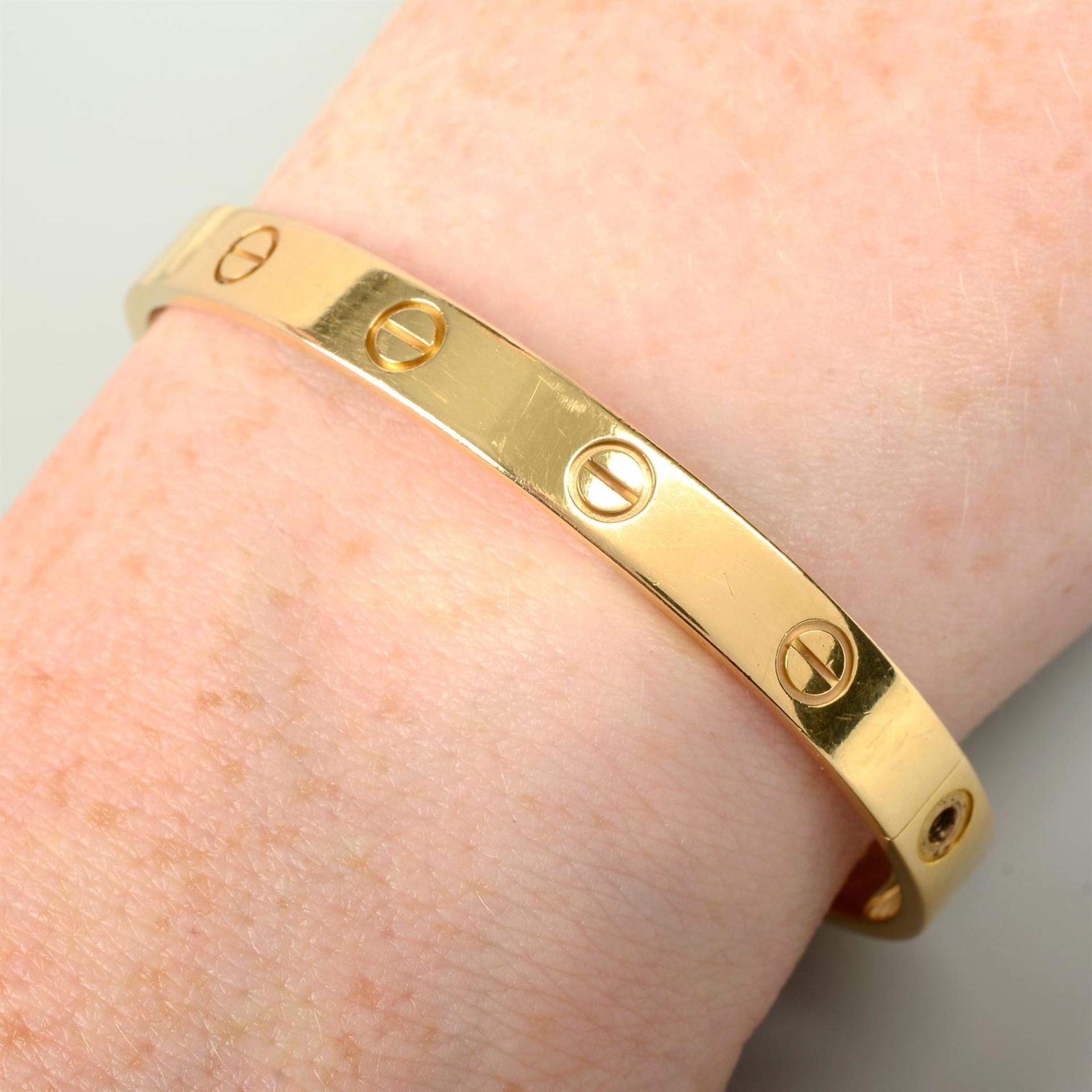 An 18ct gold 'Love' bangle, by Cartier. - Image 4 of 4