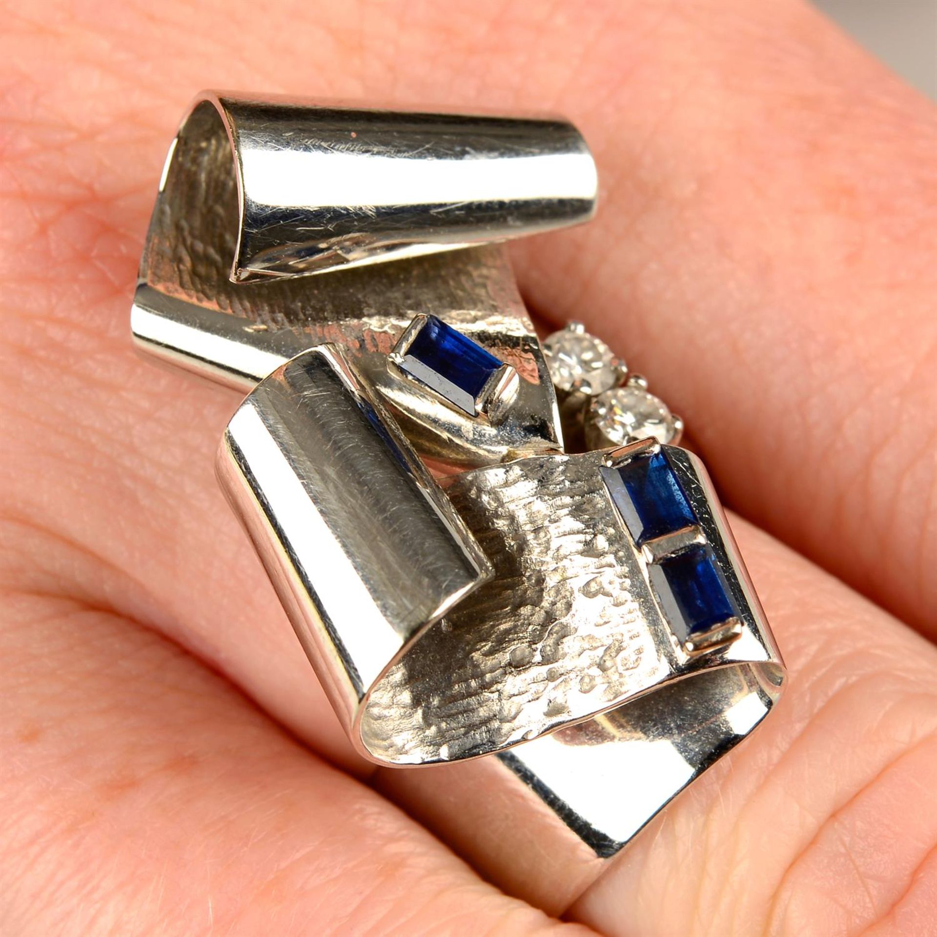 A sapphire and brilliant-cut diamond ring, by Gübelin.