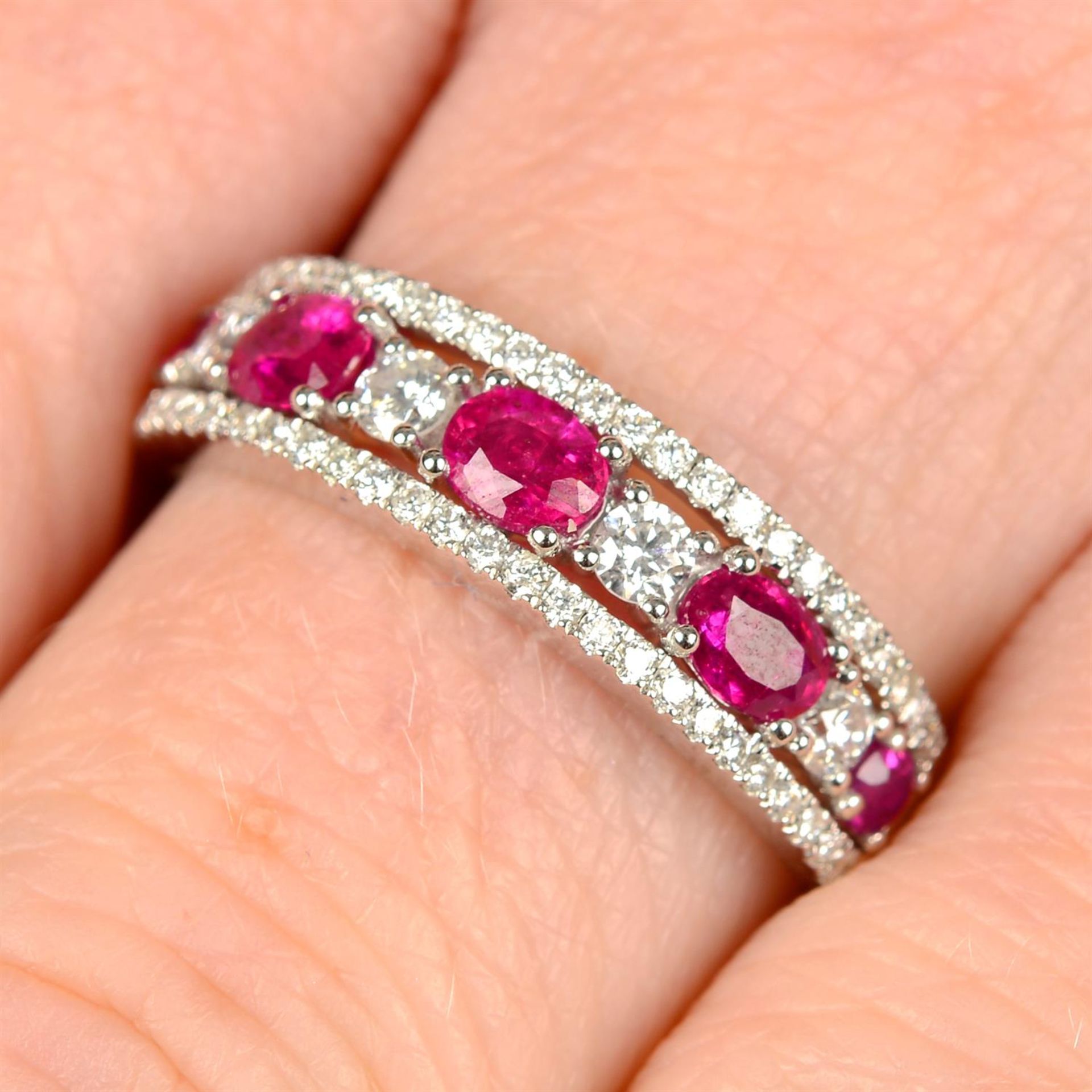 An 18ct gold ruby and diamond band ring.