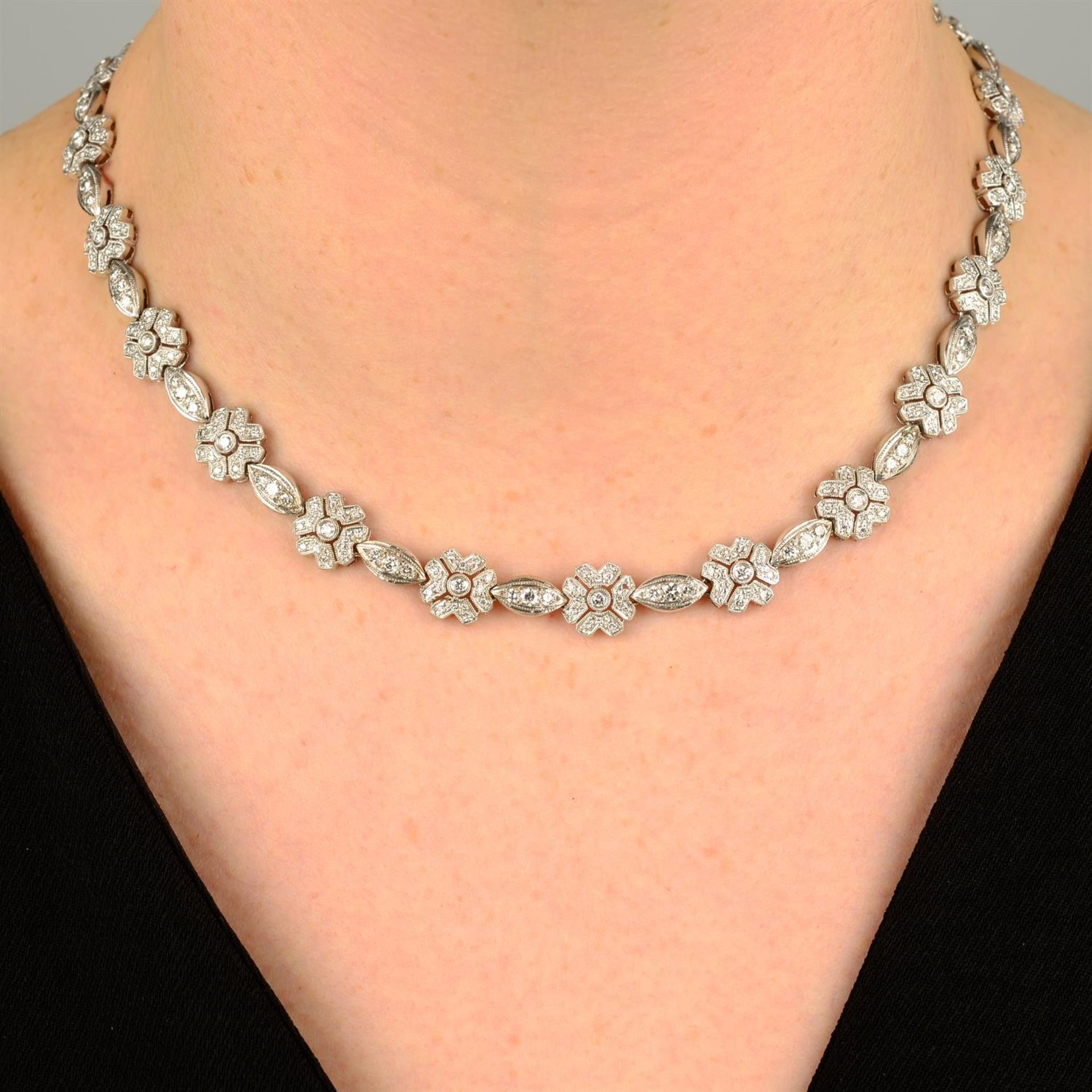 A brilliant-cut diamond floral necklace, with matching bracelet.