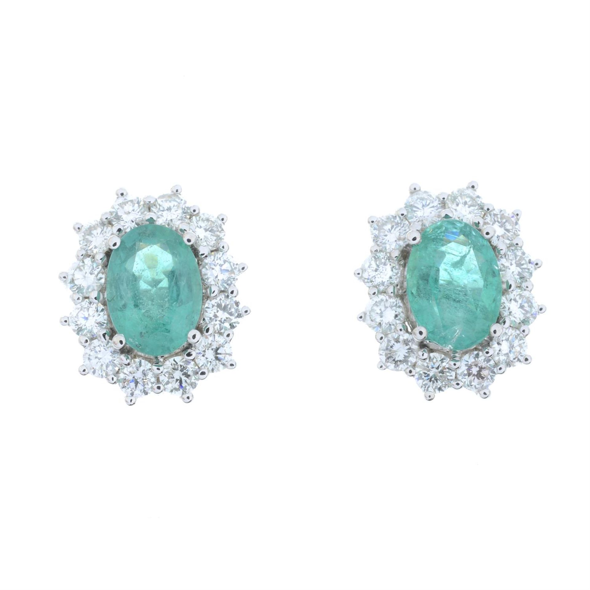 A pair of 18ct gold emerald and brilliant-cut diamond cluster earrings. - Image 2 of 4