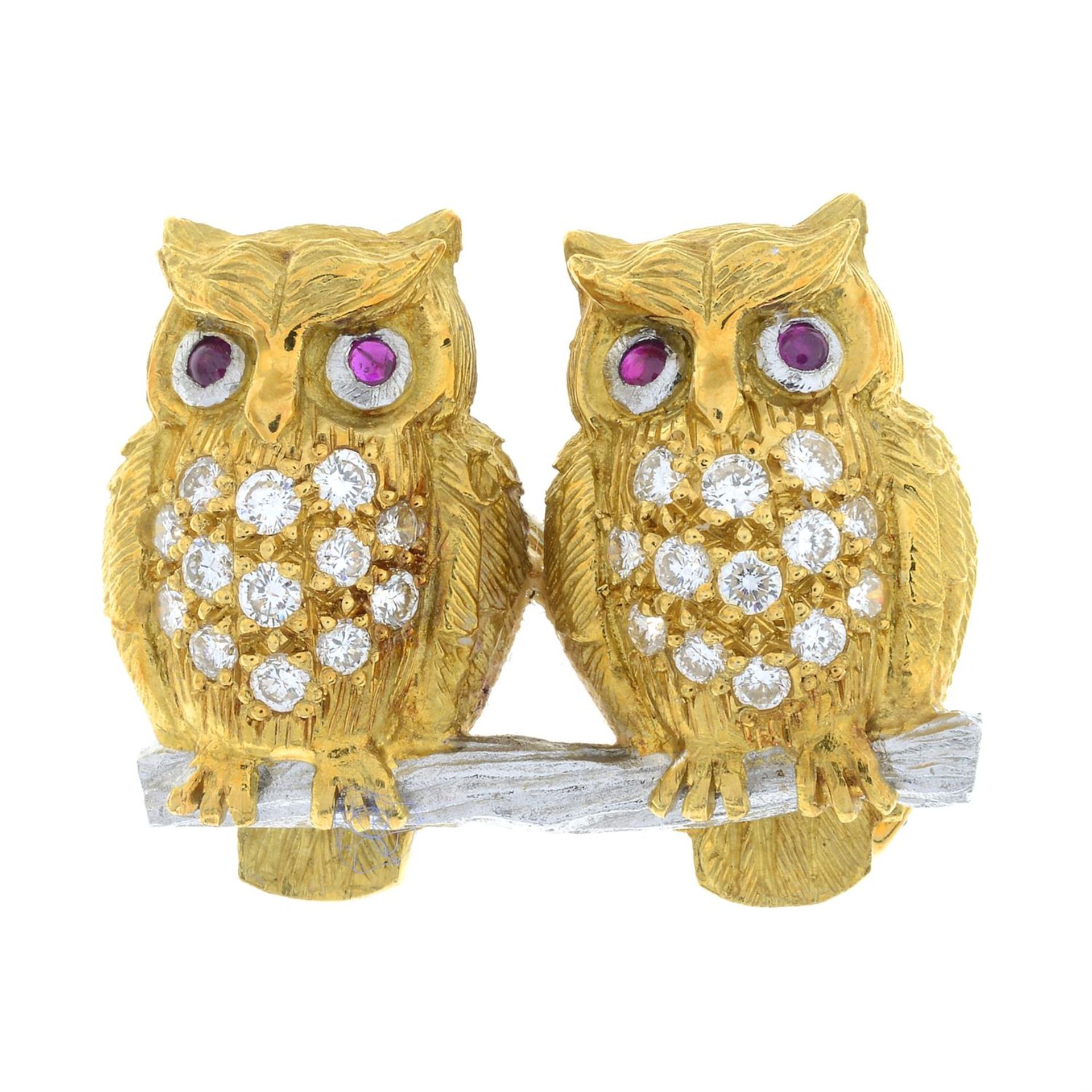 A bi-colour 18ct gold brilliant-cut diamond brooch, depicting a pair of owls, with ruby eyes, by E. - Image 2 of 4