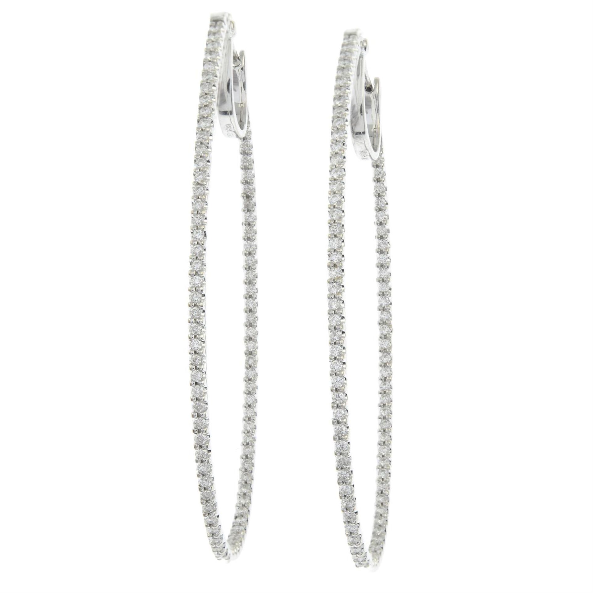 A pair of brilliant-cut diamond oval hoop earrings. - Image 2 of 3