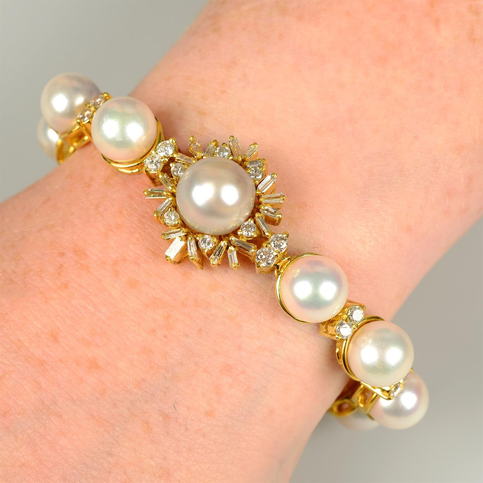 A cultured pearl and vari-cut diamond bracelet.