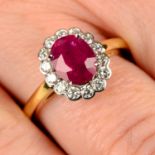 A ruby and brilliant-cut diamond cluster ring.