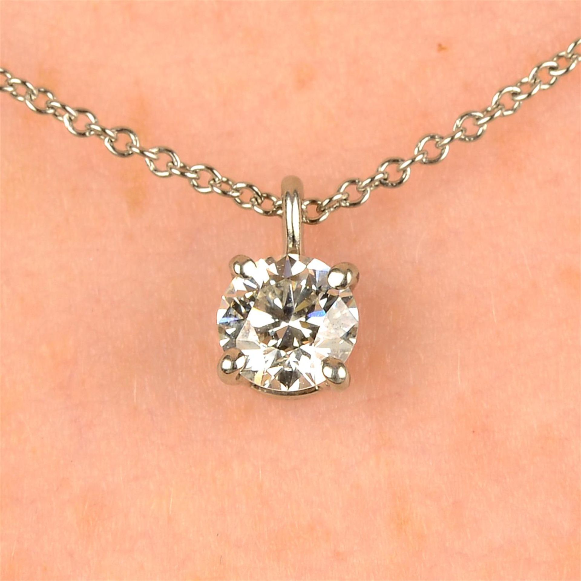 A platinum brilliant-cut diamond pendant, on chain, by Tiffany & Co.