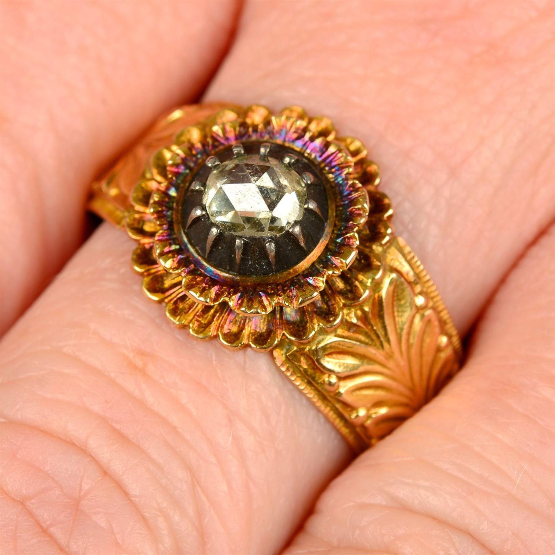 A 19th century 18ct gold rose-cut diamond floral ring, with foliate tapered band.
