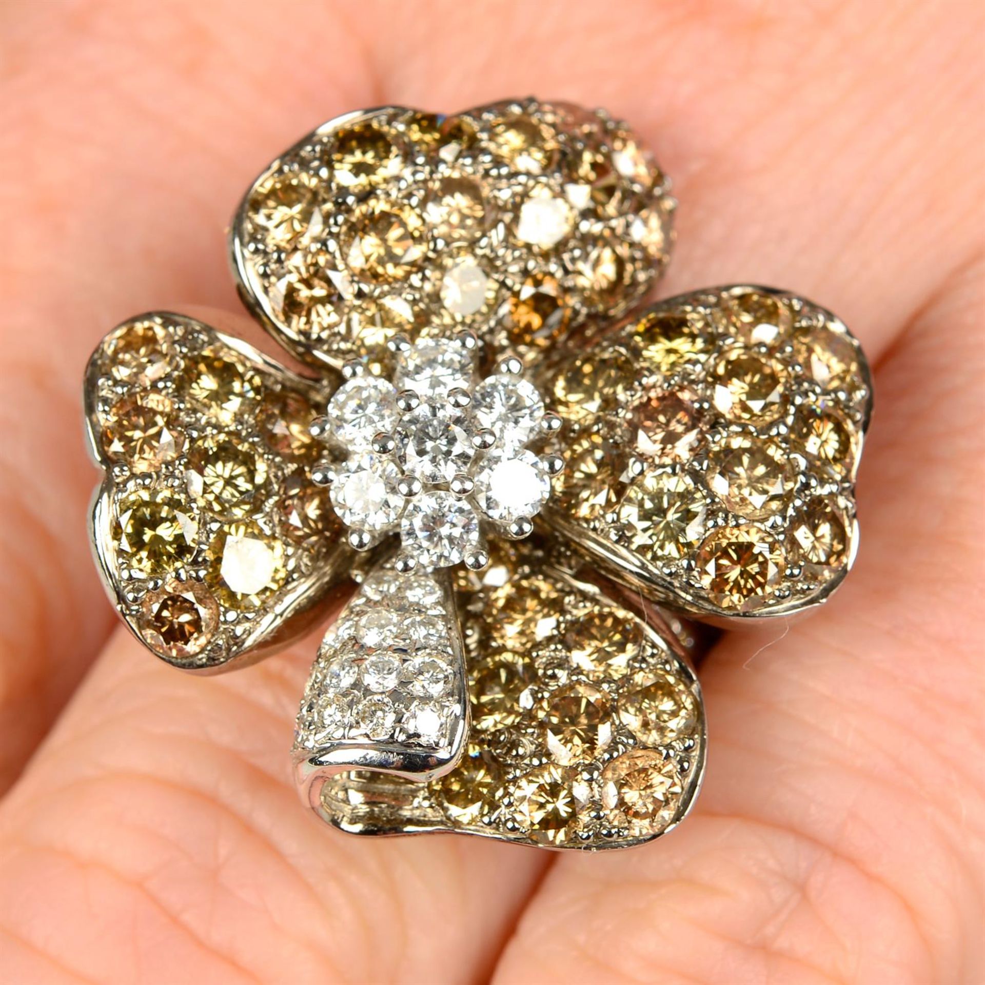 A brilliant-cut diamond and 'brown' diamond floral dress ring.