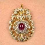 A ruby cabochon and brilliant-cut diamond floral pendant.