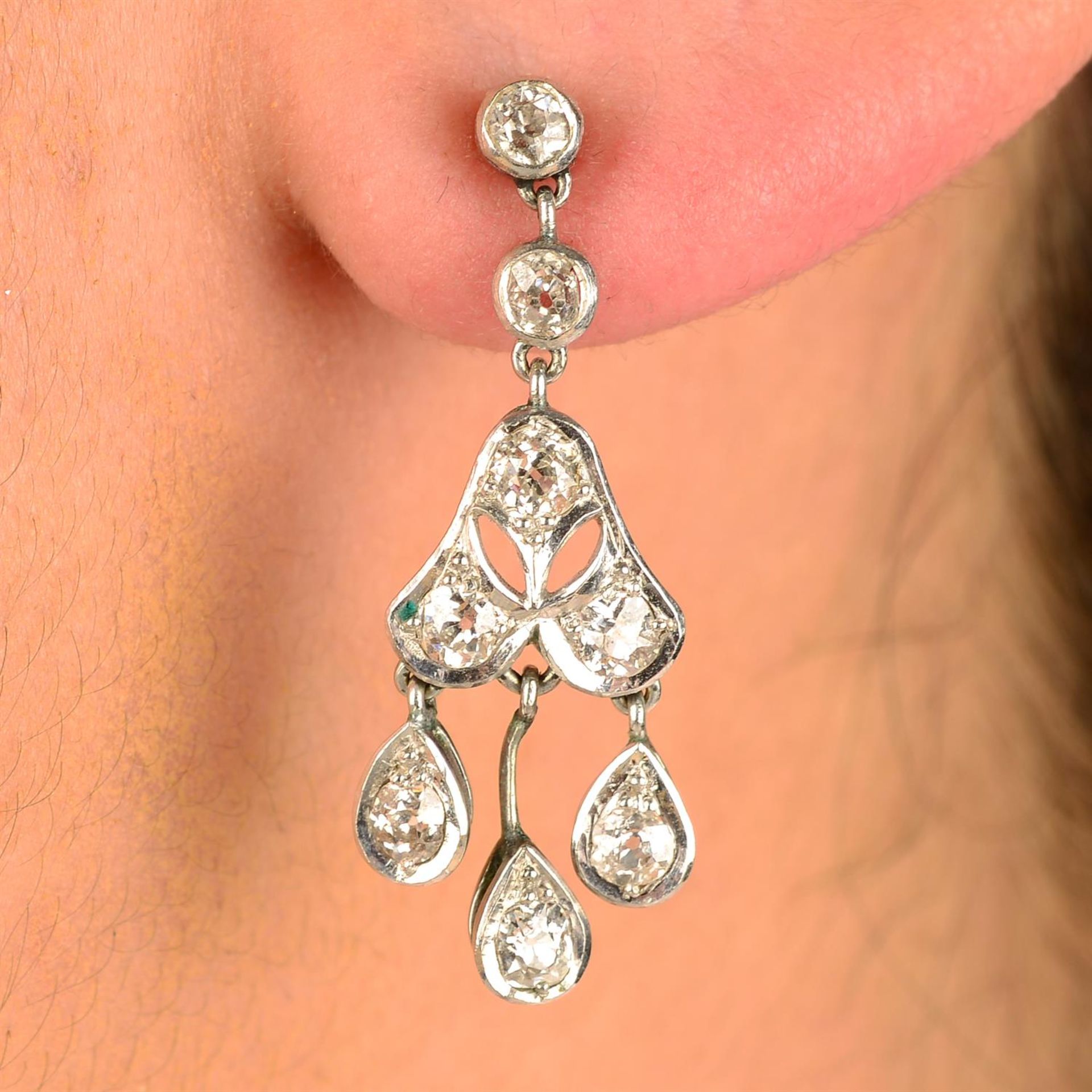 A pair of old-cut diamond drop earrings.
