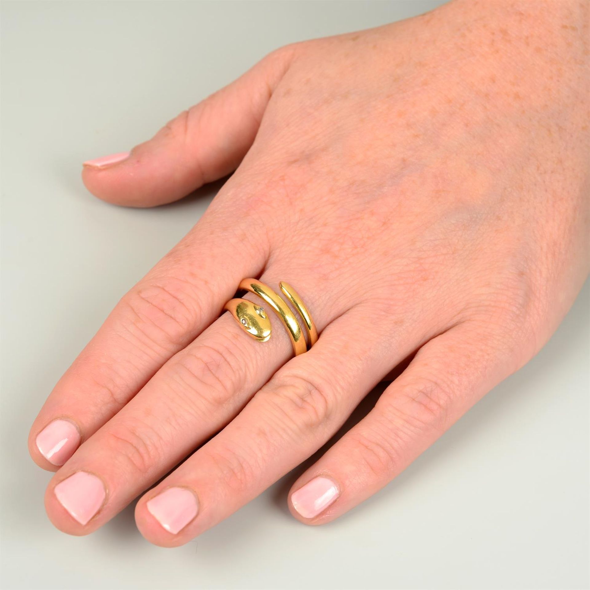 An 18ct gold snake ring, with diamond point eyes. - Image 5 of 5