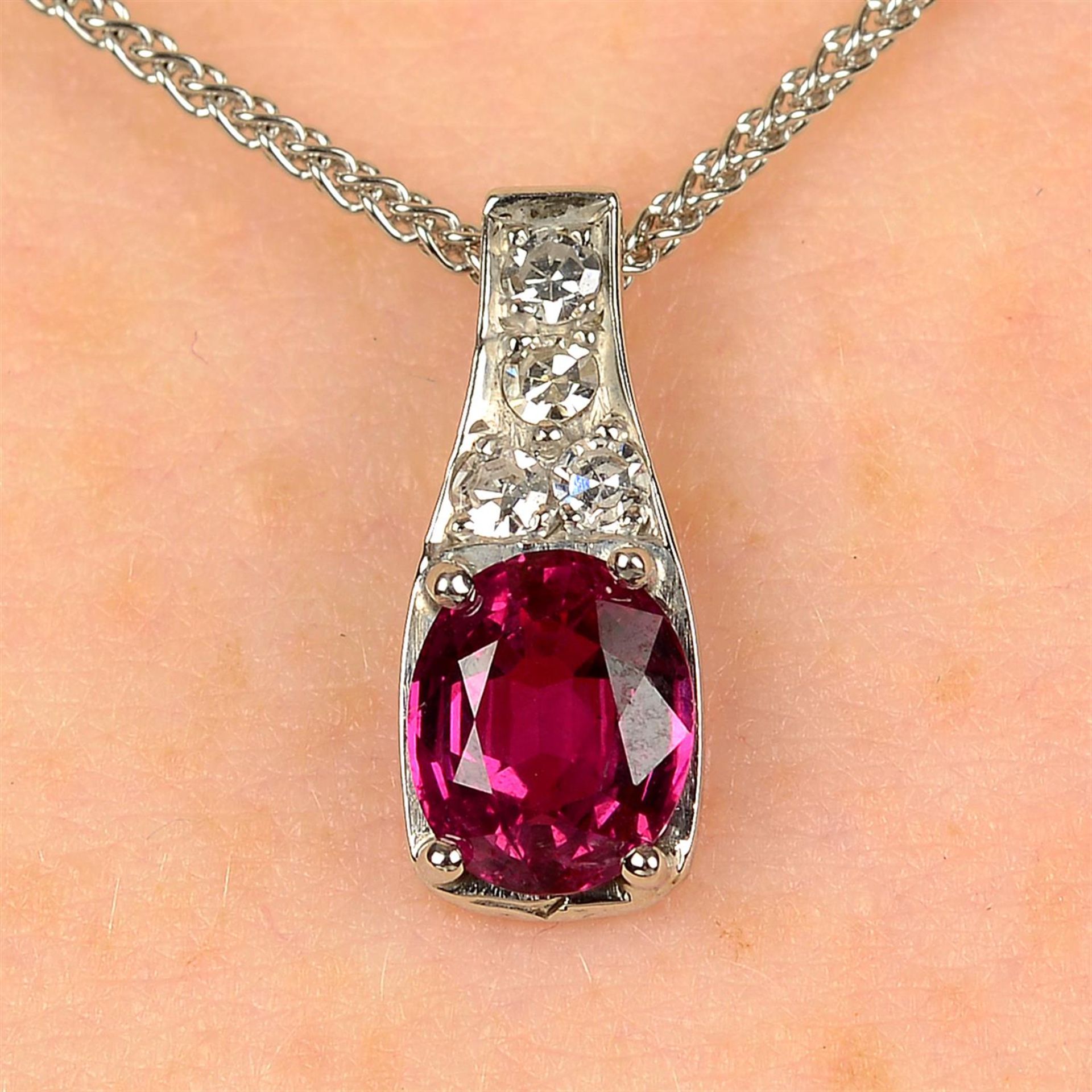 A ruby and diamond pendant, with 18ct gold chain.