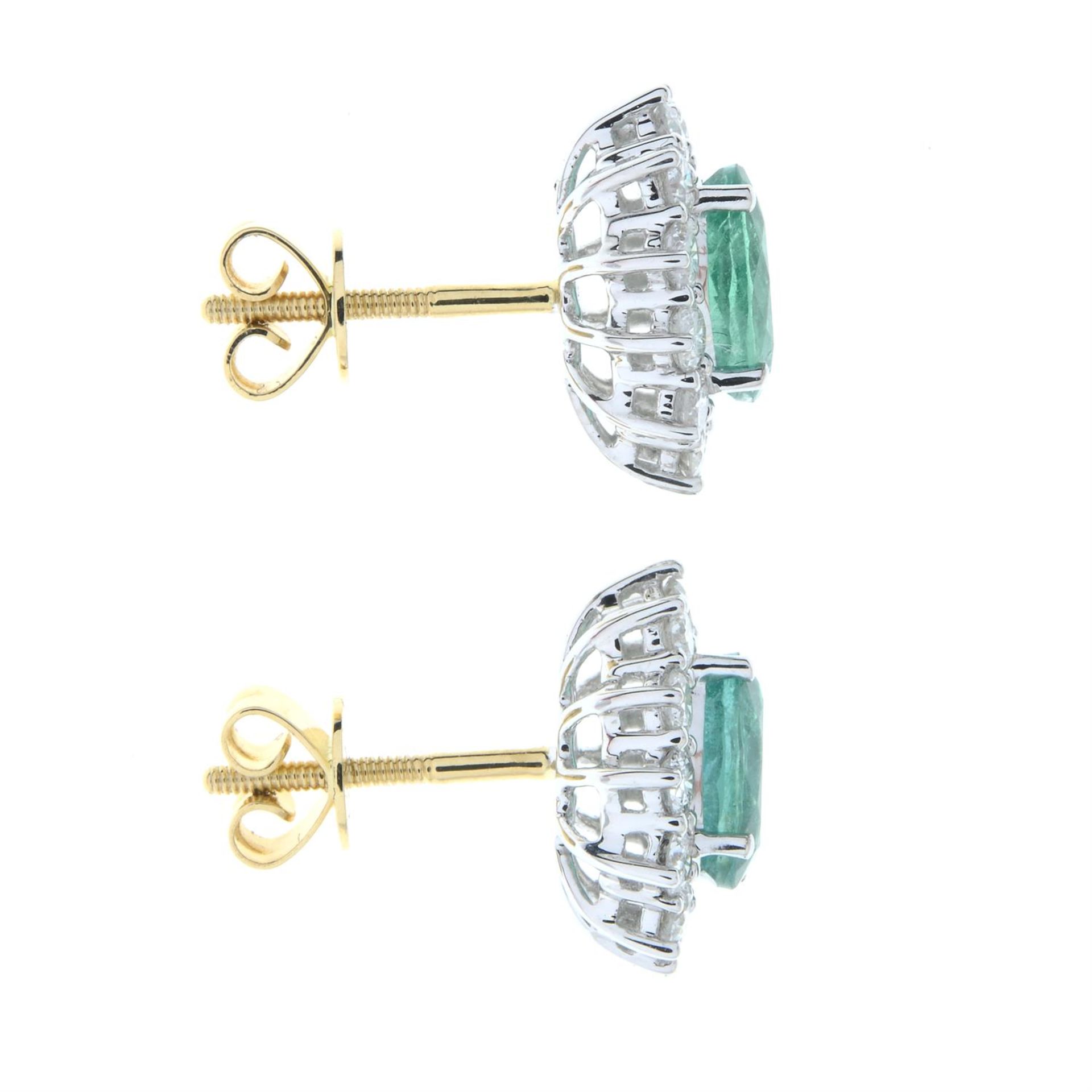 A pair of 18ct gold emerald and brilliant-cut diamond cluster earrings. - Image 4 of 4