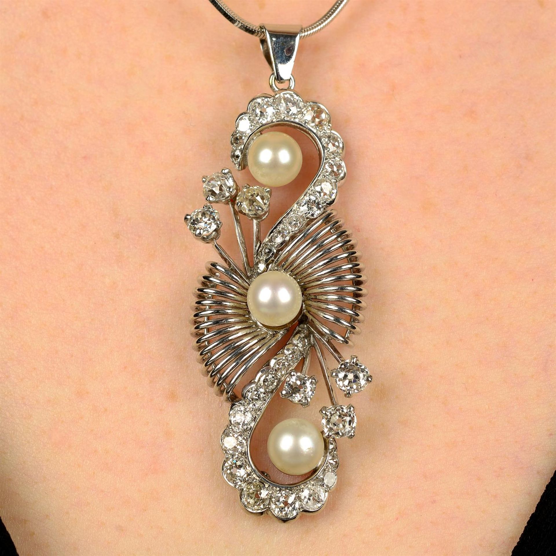 A mid 20th century cultured pearl and old-cut diamond pendant, with later chain.