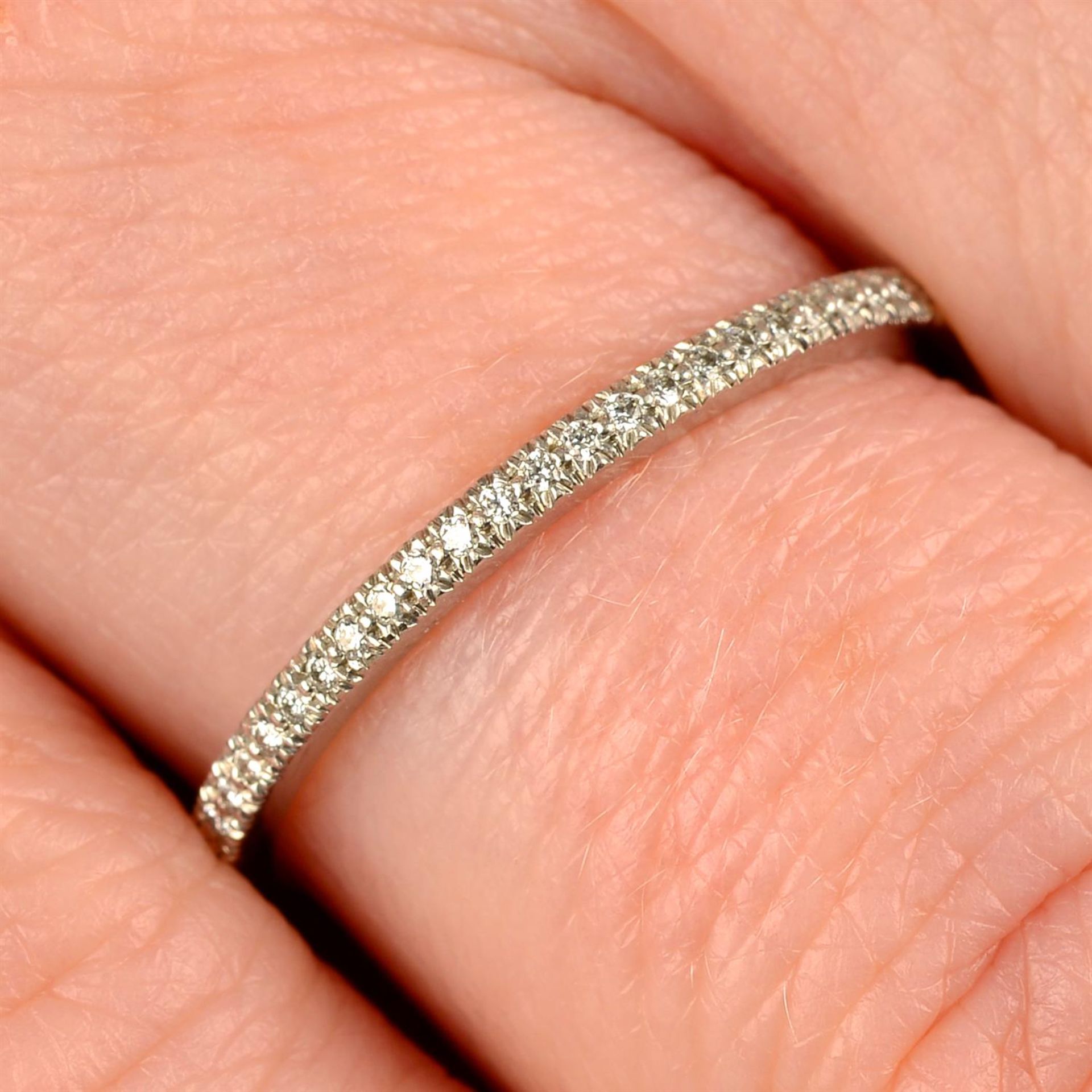 A platinum brilliant-cut diamond half eternity ring, by Tiffany & Co.