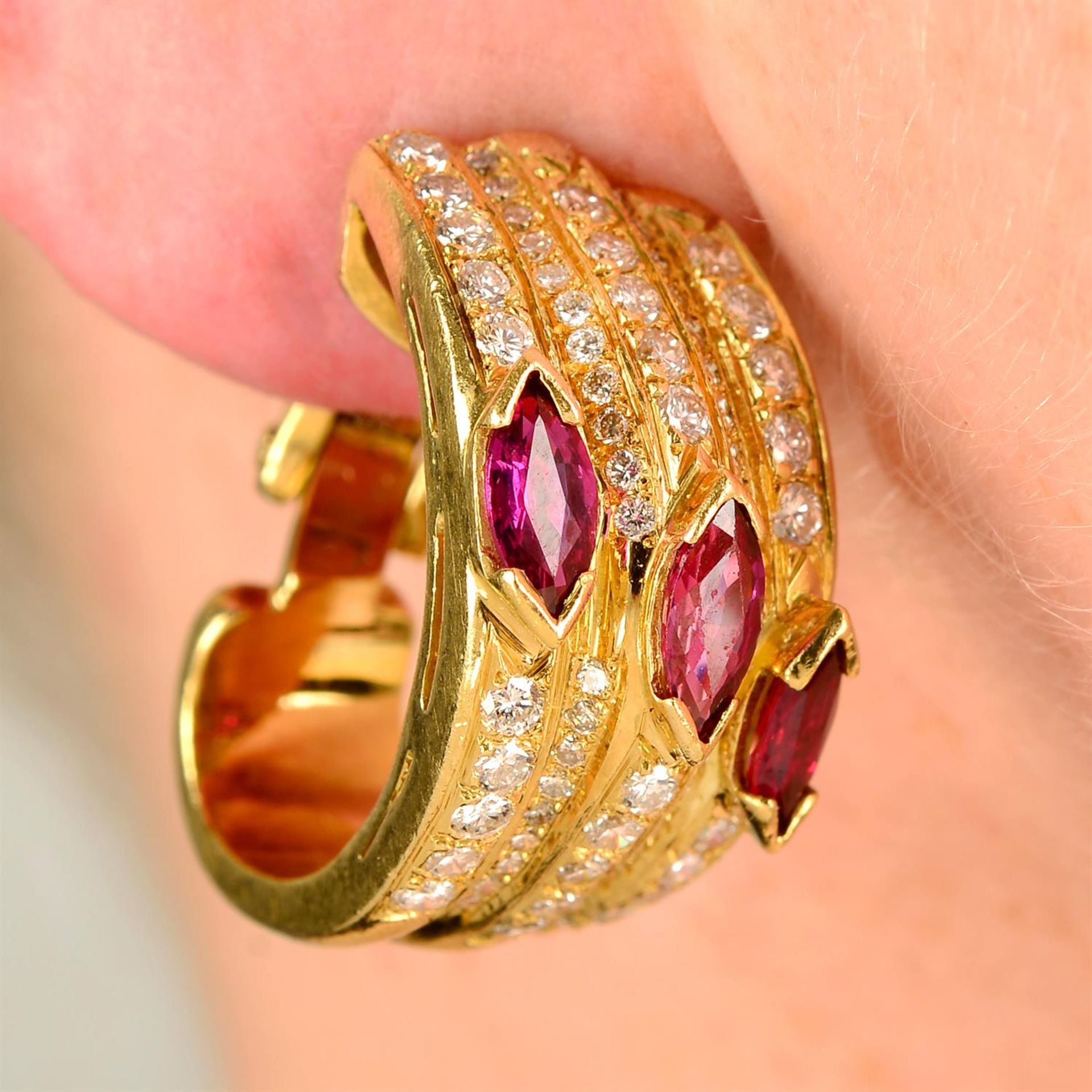 A pair of ruby and brilliant-cut diamond hoop earrings.