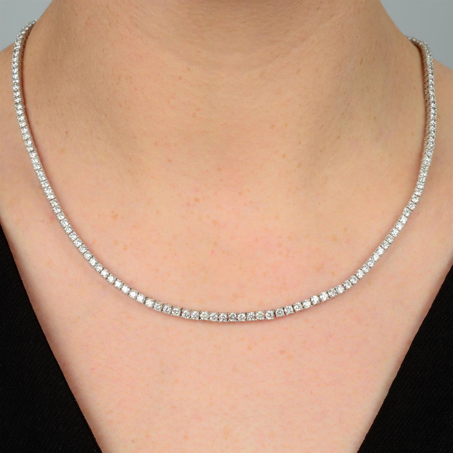 A brilliant-cut diamond line necklace.
