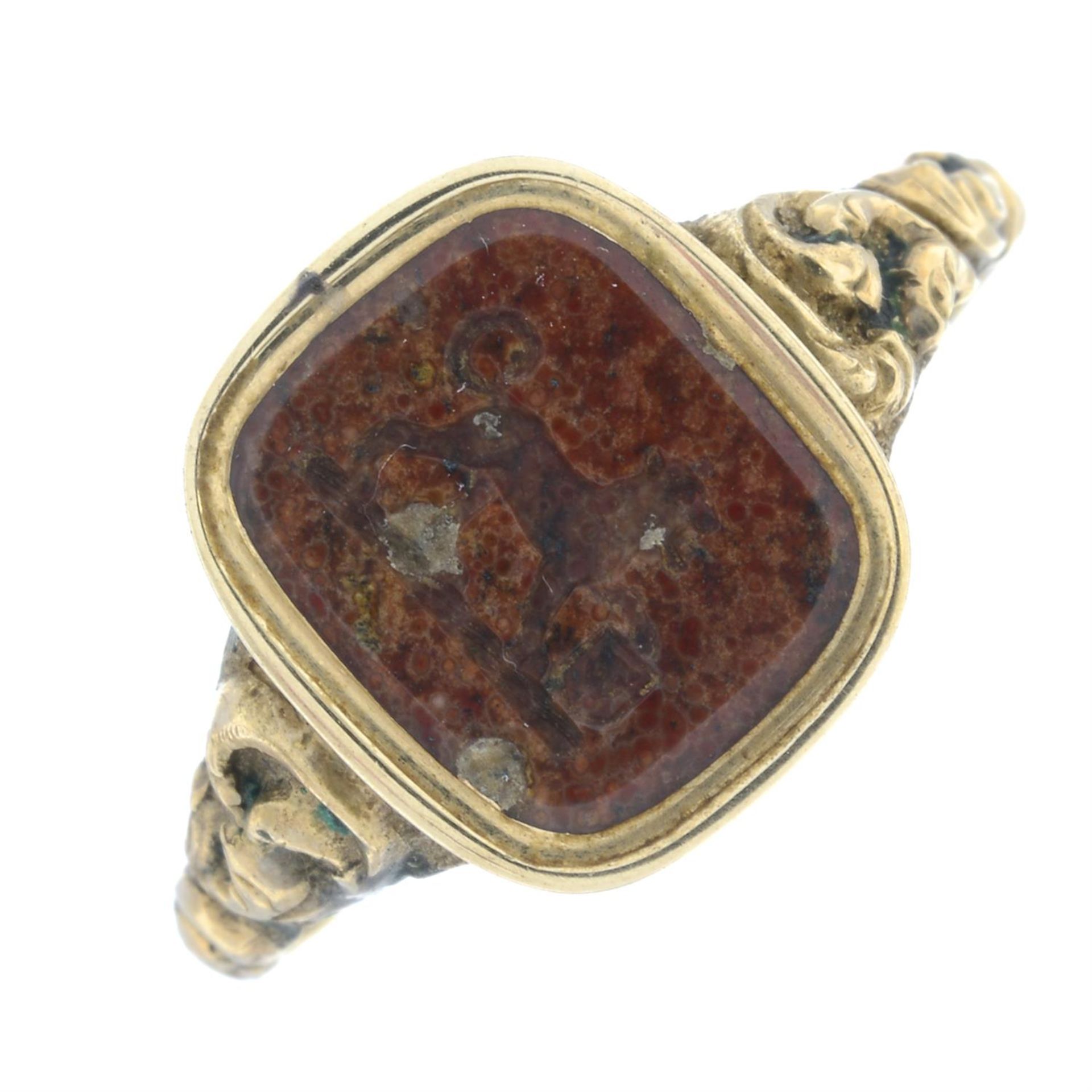 An early to mid 19th century gold agate intaglio signet ring, carved with a crest of a lion holding - Image 2 of 6