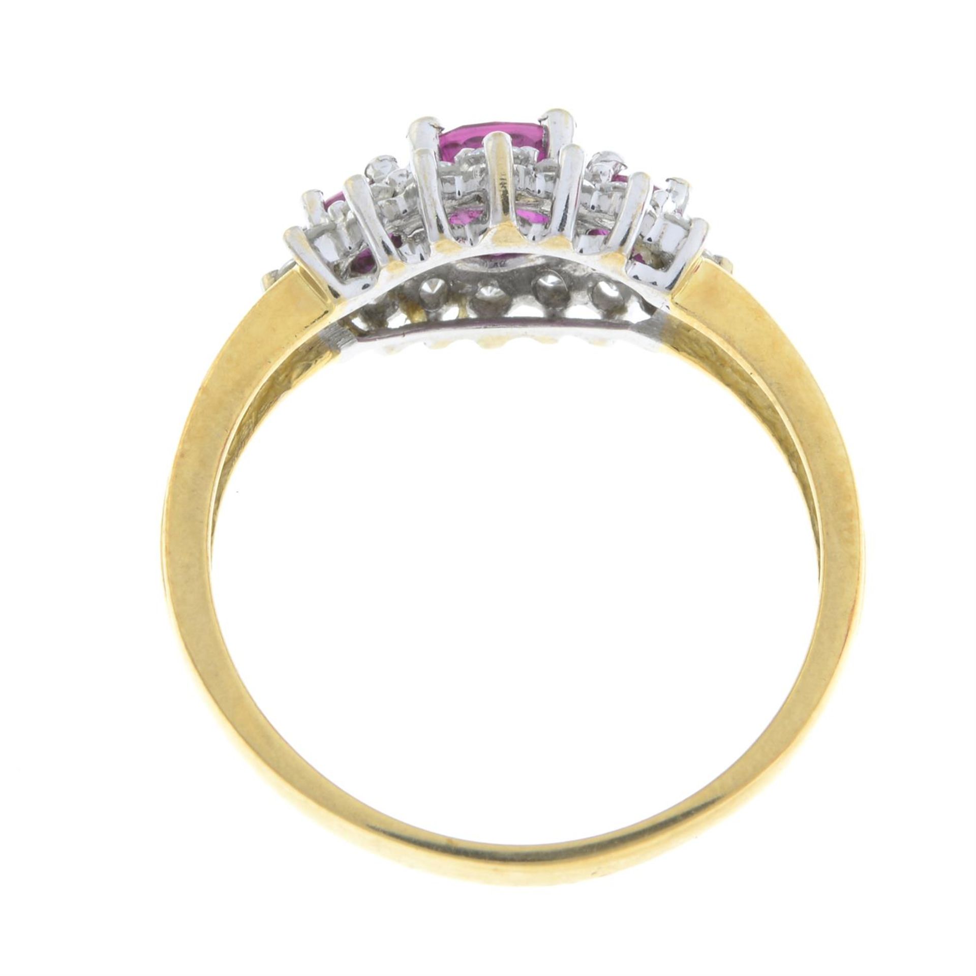 An 18ct gold graduated ruby three-stone ring, with brilliant-cut diamond surround. - Image 3 of 5
