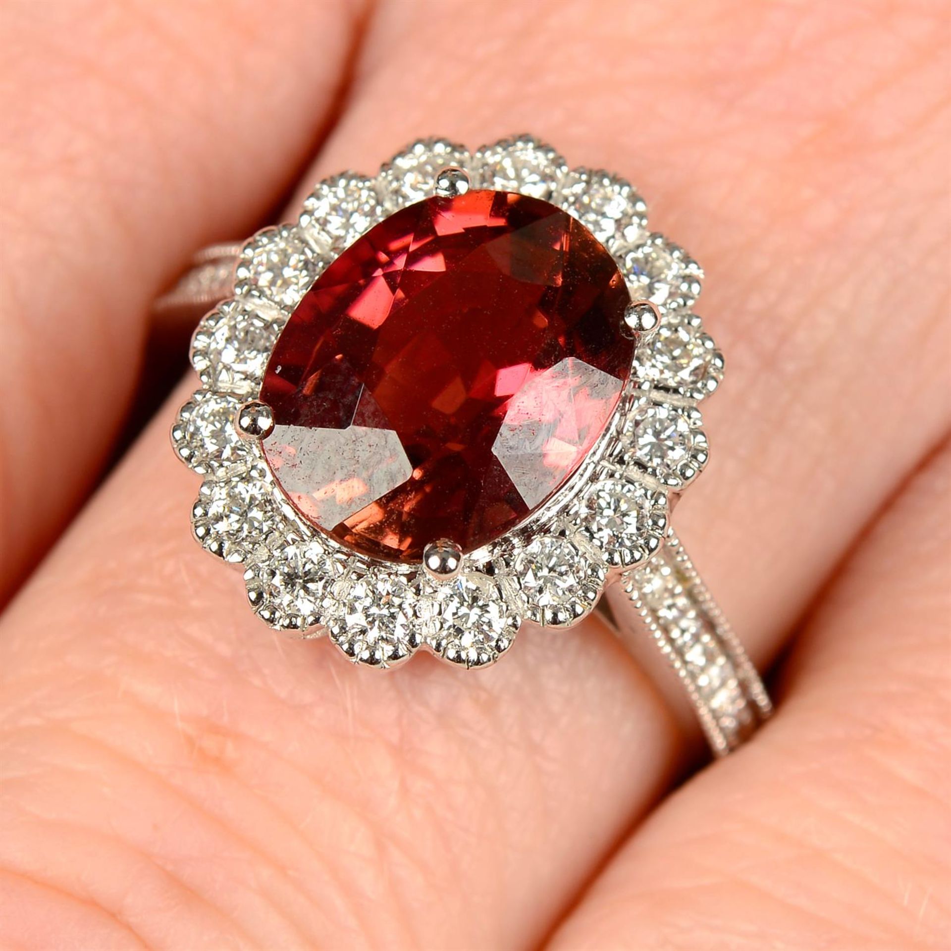 An 18ct gold tourmaline and brilliant-cut diamond cluster ring.