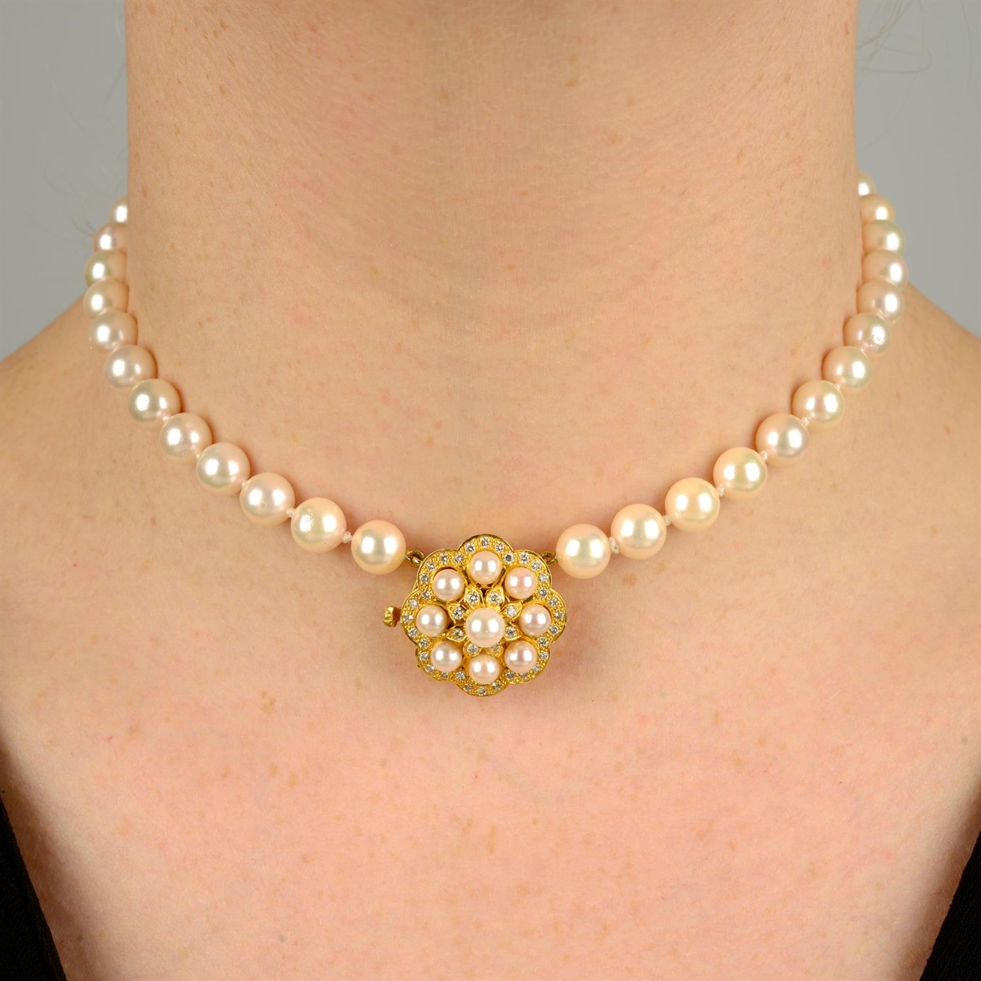 A cultured pearl single-strand necklace, on 18ct gold cultured pearl and diamond three-strand clasp.