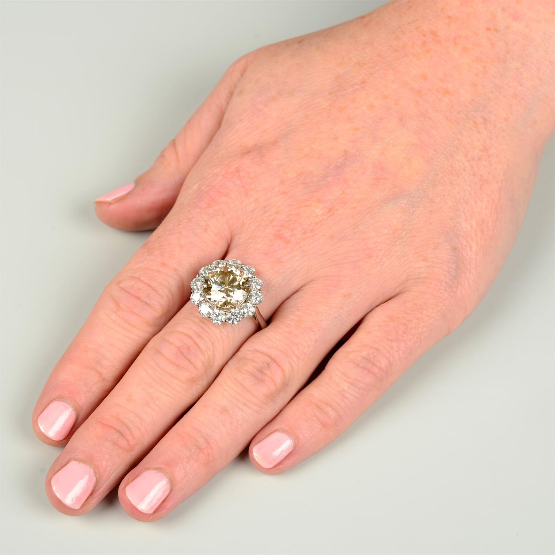 A platinum 'brown' diamond and brilliant-cut diamond cluster ring. - Image 5 of 5
