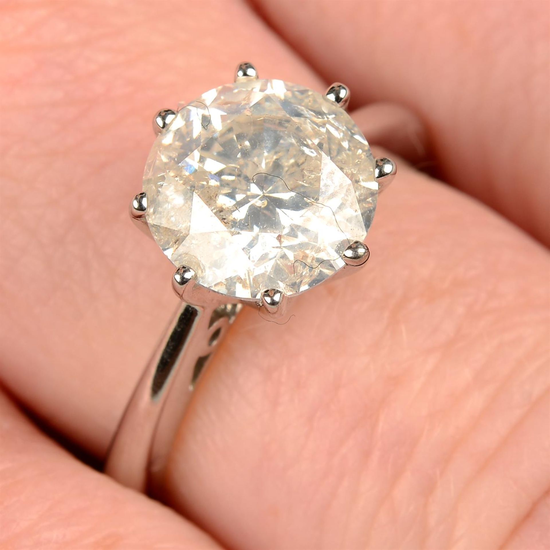 An 18ct gold brilliant-cut diamond single-stone ring.