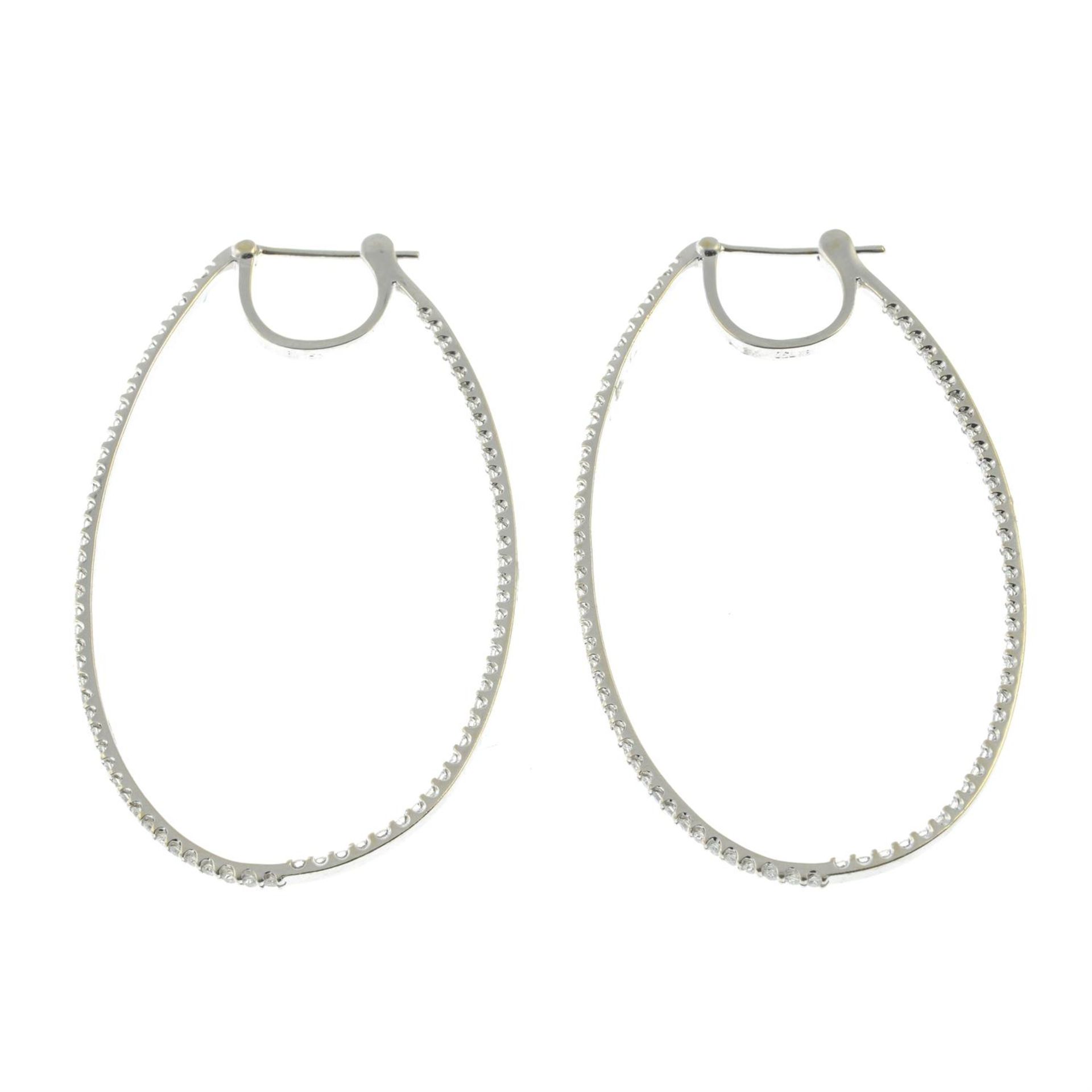 A pair of brilliant-cut diamond oval hoop earrings. - Image 3 of 3