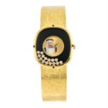 CHOPARD - a yellow metal diamond set bracelet watch, 30mm.