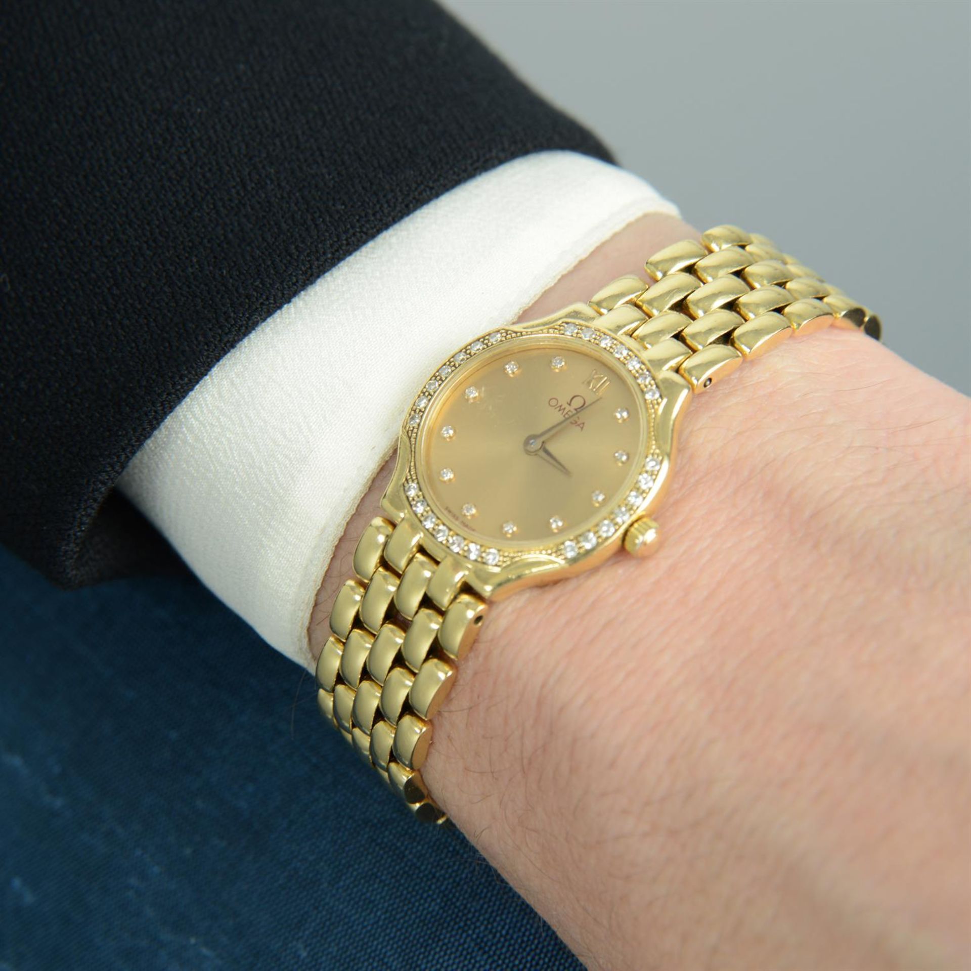 OMEGA - an 18ct gold bracelet watch, 22mm. - Image 5 of 5