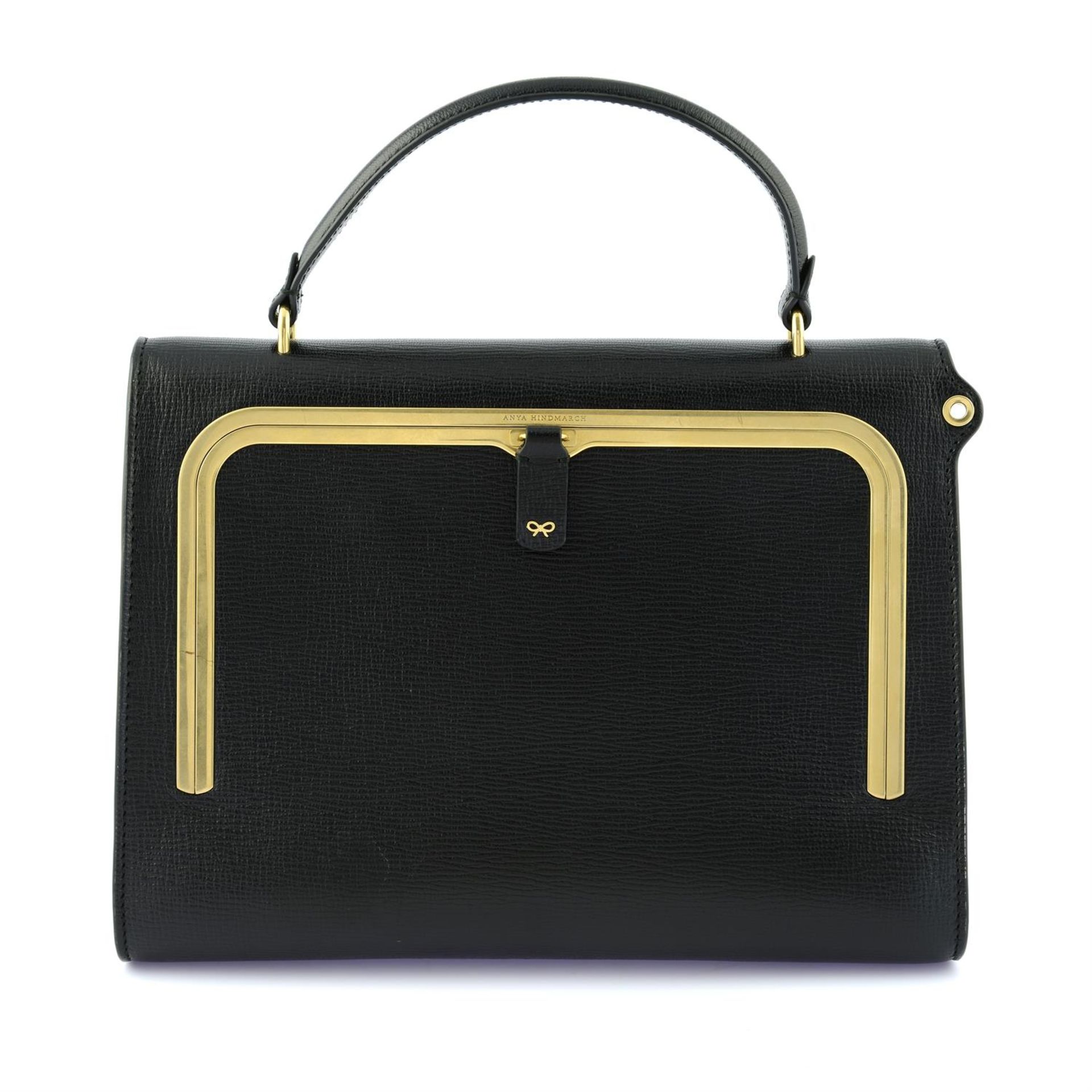ANYA HINDMARCH - a black leather handbag.