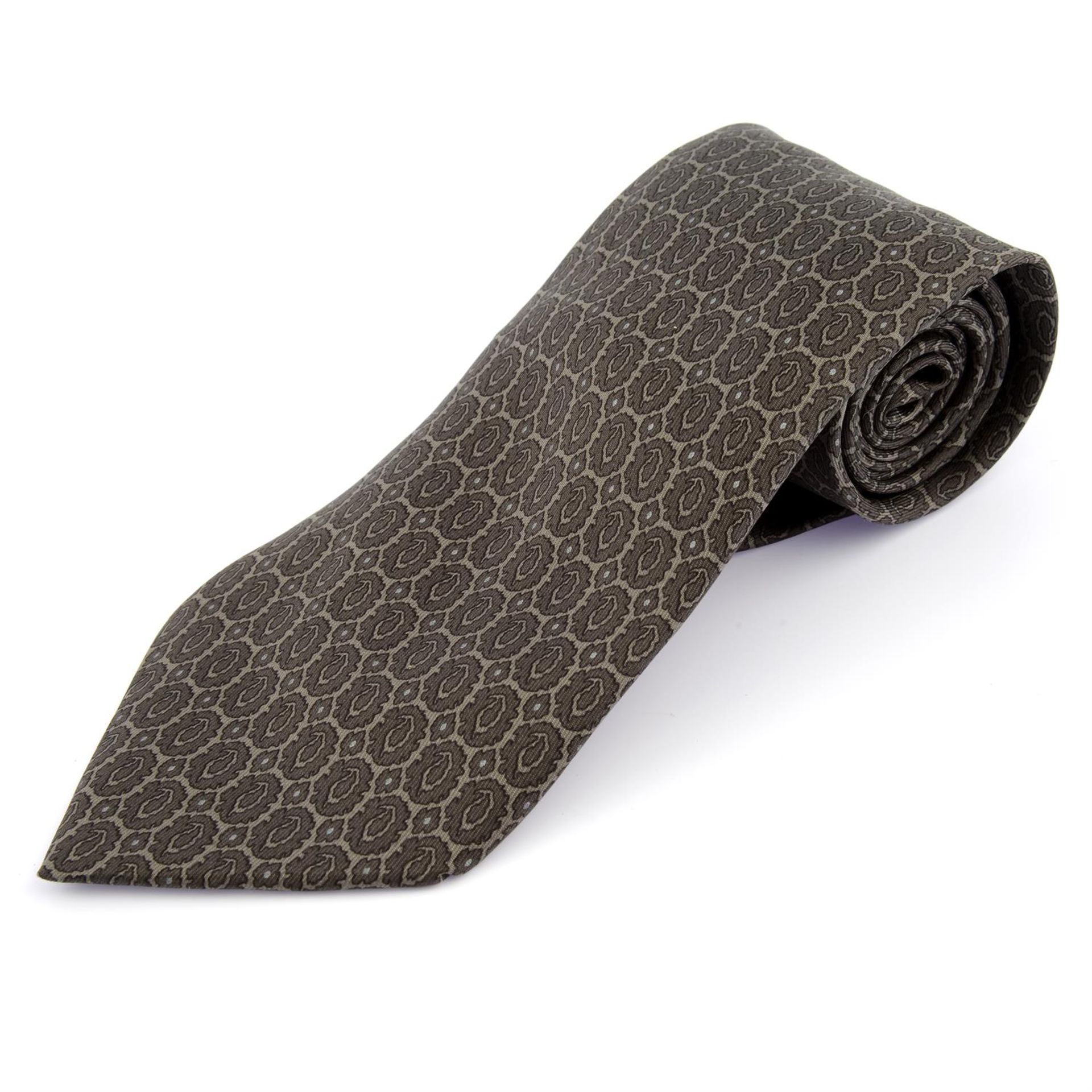 HERMÈS - a light brown printed silk tie.