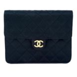 CHANEL - a small black satin handbag.