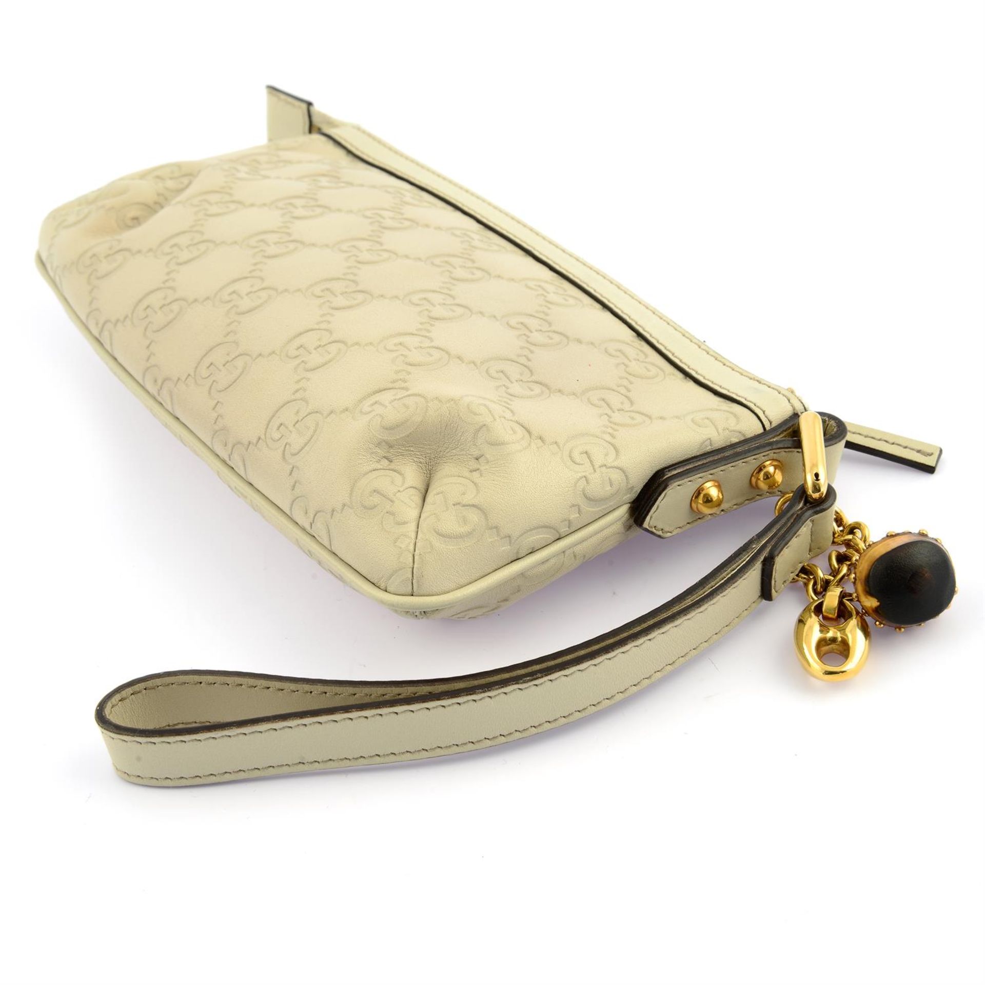 GUCCI - a beige leather Guccissima wristlet. - Image 2 of 3