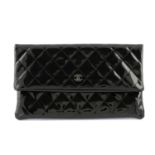 CHANEL - a black quilted patent leather fold clutch bag.