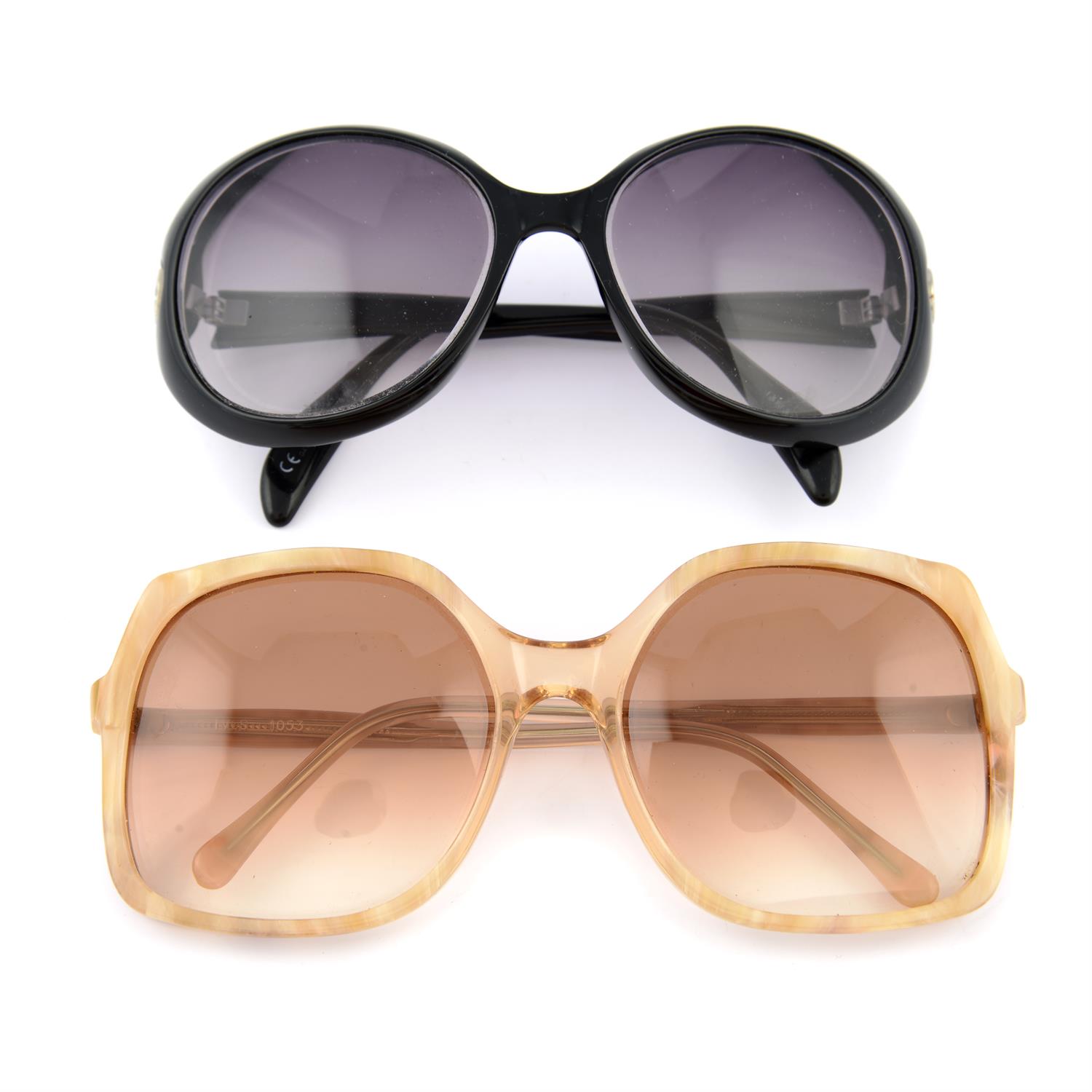 A pair of Giorgio Armani prescription glasses together with a pair of vintage sunglasses.