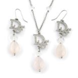 CHRISTIAN DIOR - an Oblique and rose quartz pendant necklace and matching earrings.