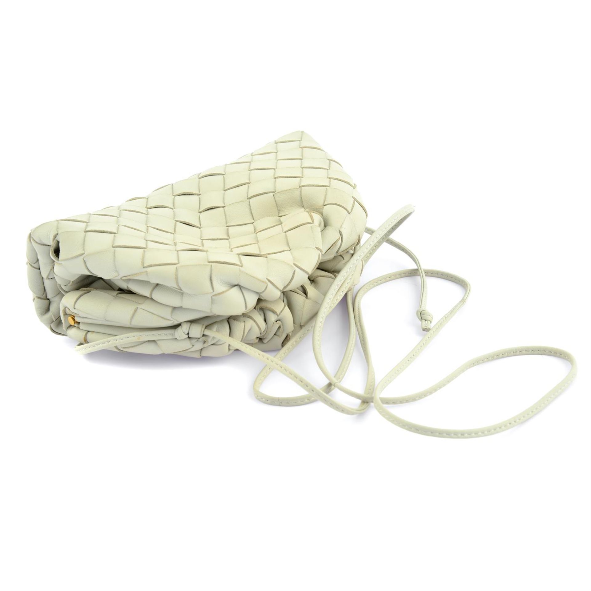 BOTTEGA VENETA - an off-white leather The Pouch. - Image 3 of 4