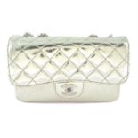 CHANEL - a metallic gold calfskin leather accordion flap handbag.