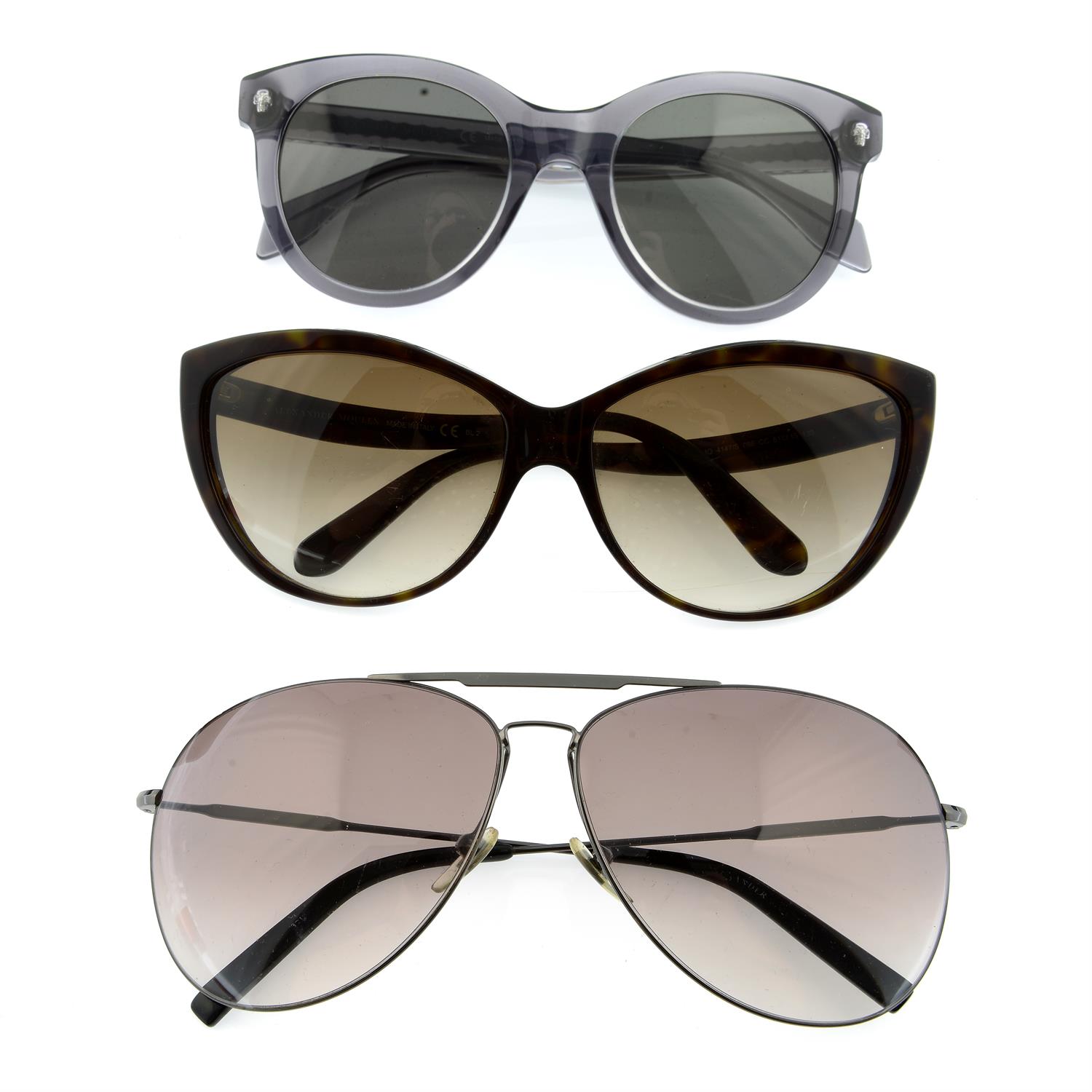 ALEXANDER MCQUEEN - three pairs of sunglasses.