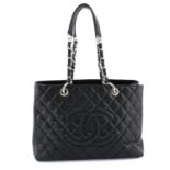 CHANEL - a black Caviar leather GST.