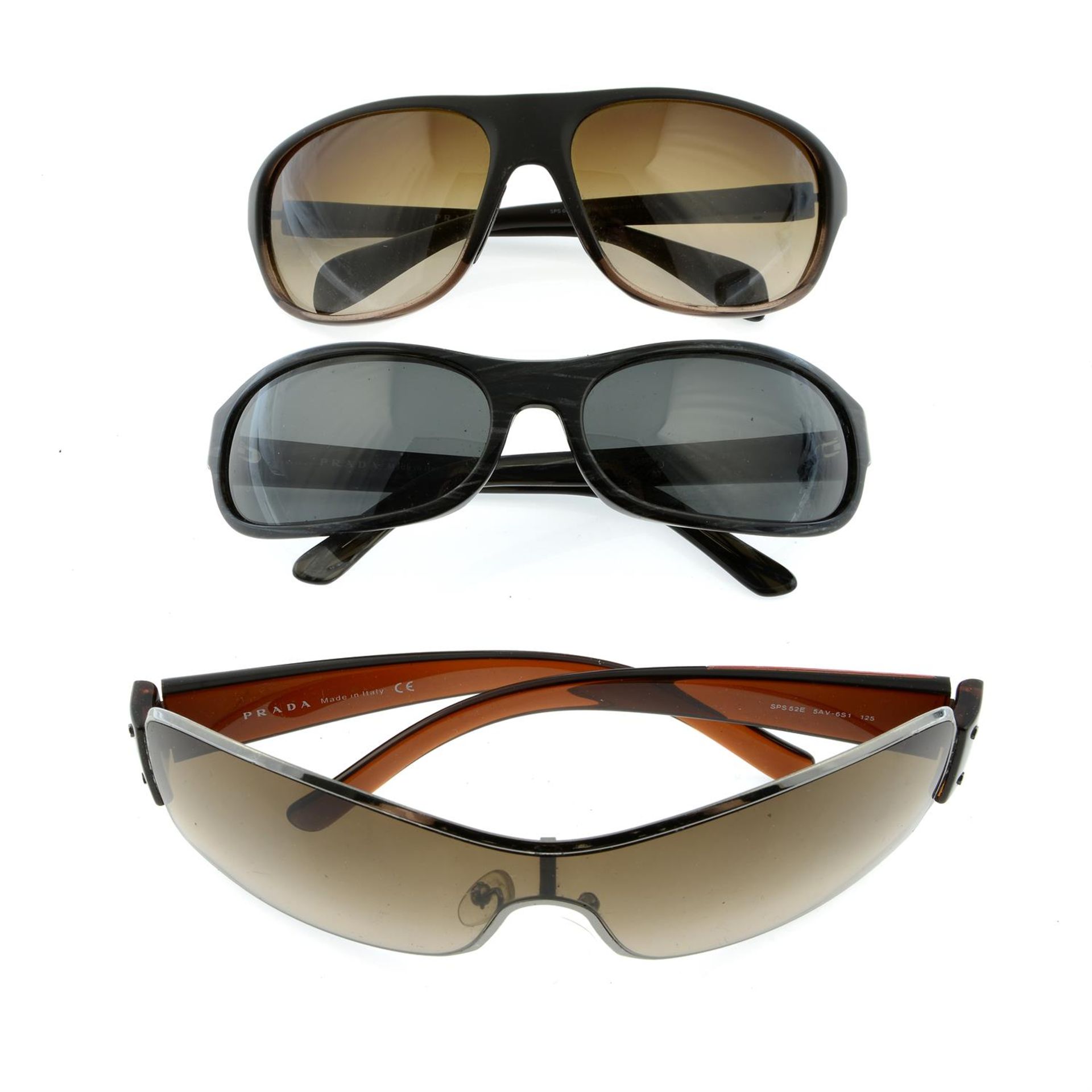 PRADA - three pairs of sunglasses.