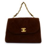 CHANEL - a brown suede leather top handle single flap handbag.