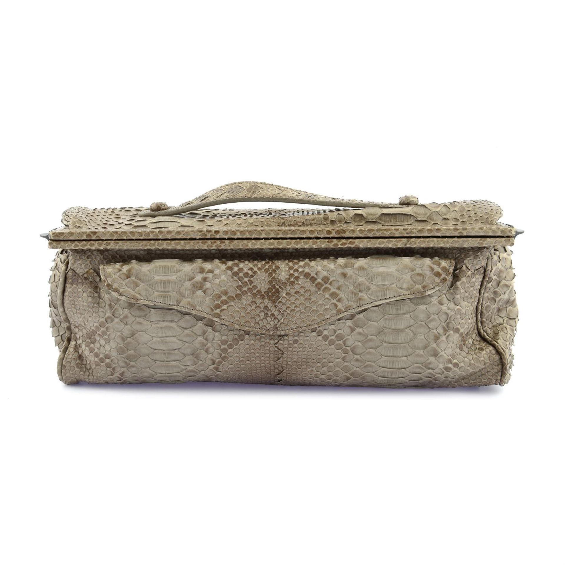 BOTTEGA VENETA - a brown Python leather clutch bag.