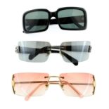 VERSACE - three pairs of sunglasses.