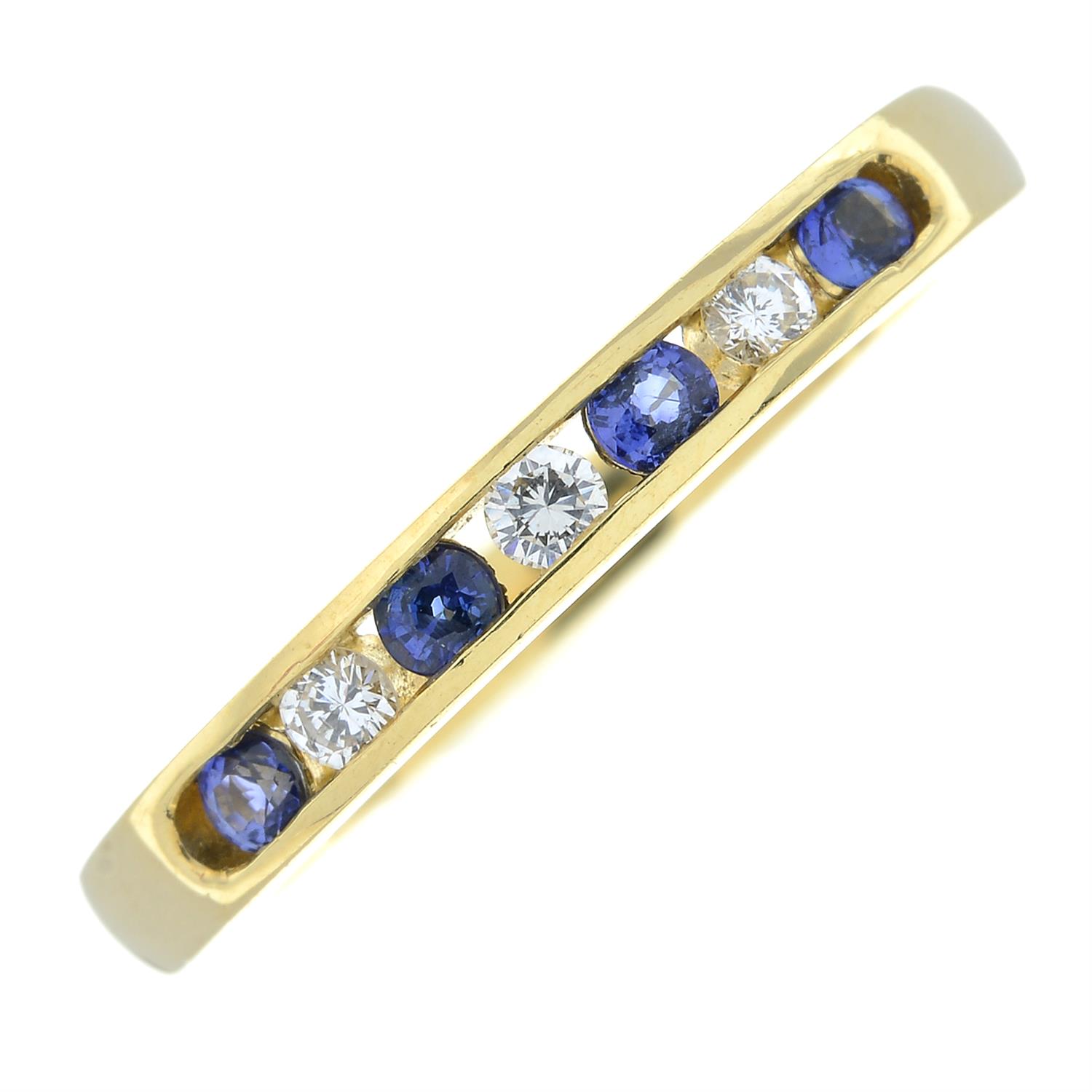 An 18ct gold sapphire and diamond half eternity ring.