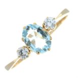 A 9ct gold aquamarine and diamond three-stone ring.