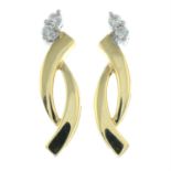 A pair of 18ct gold diamond earrings.