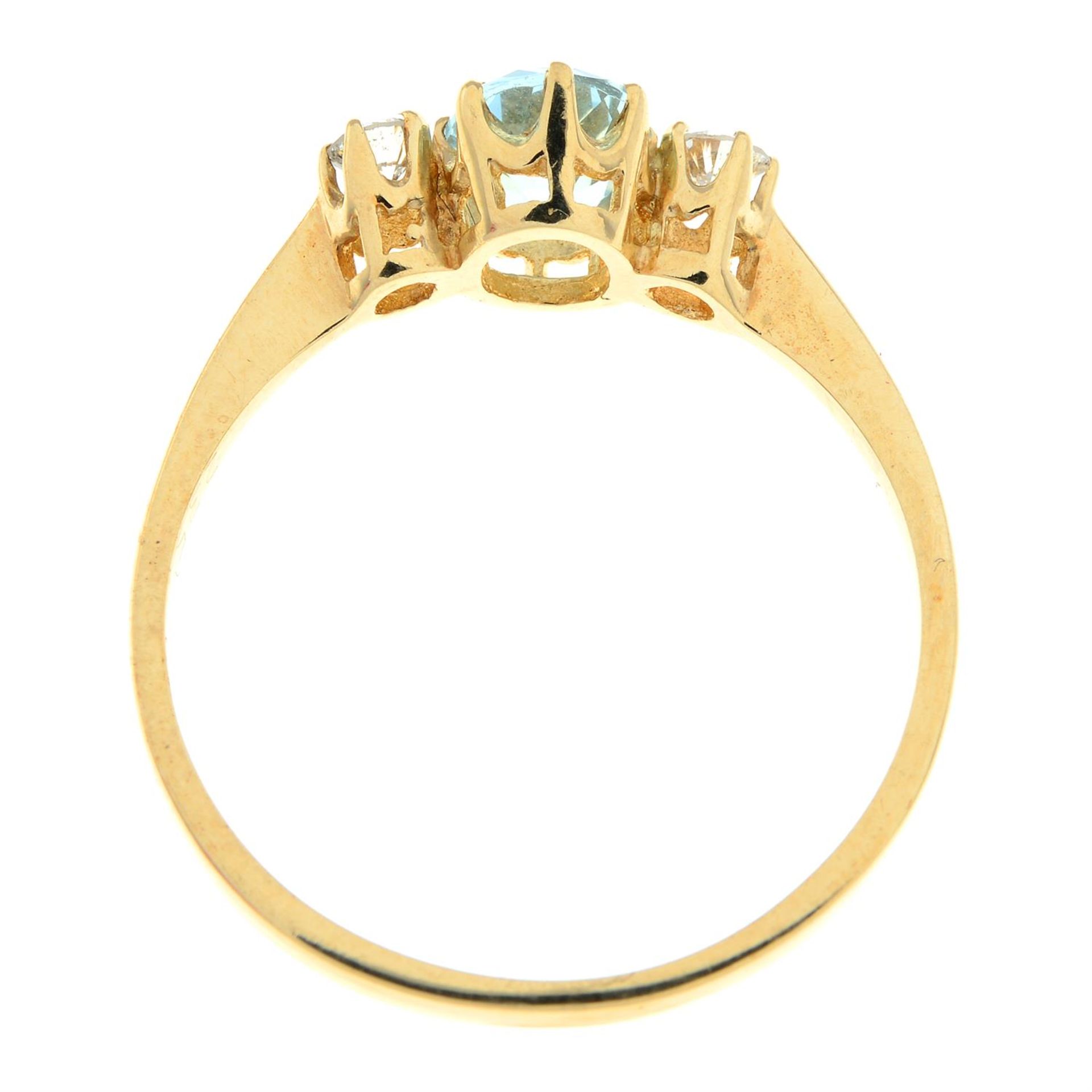A 9ct gold aquamarine and diamond three-stone ring. - Image 2 of 2